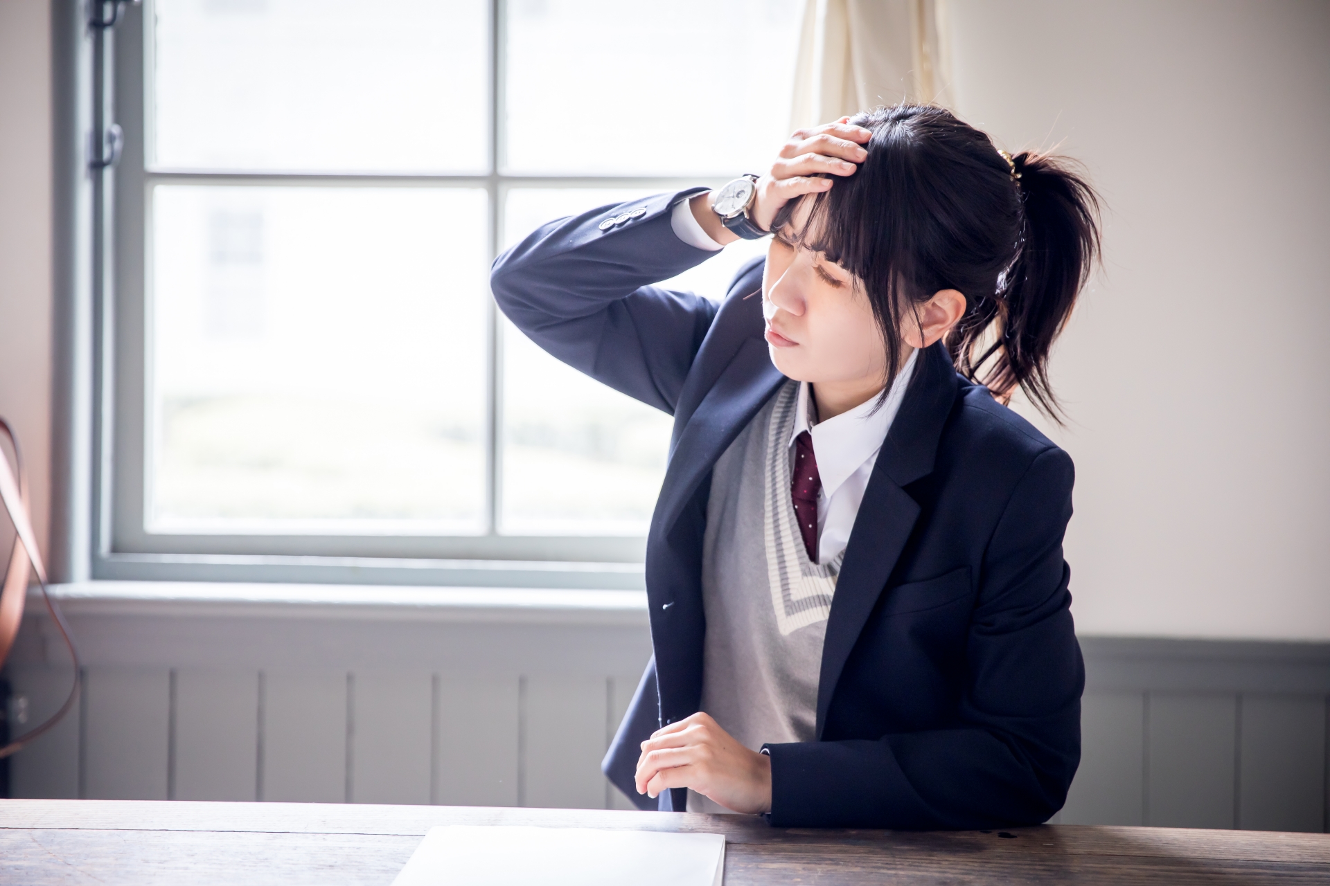 体調不良の女子高生