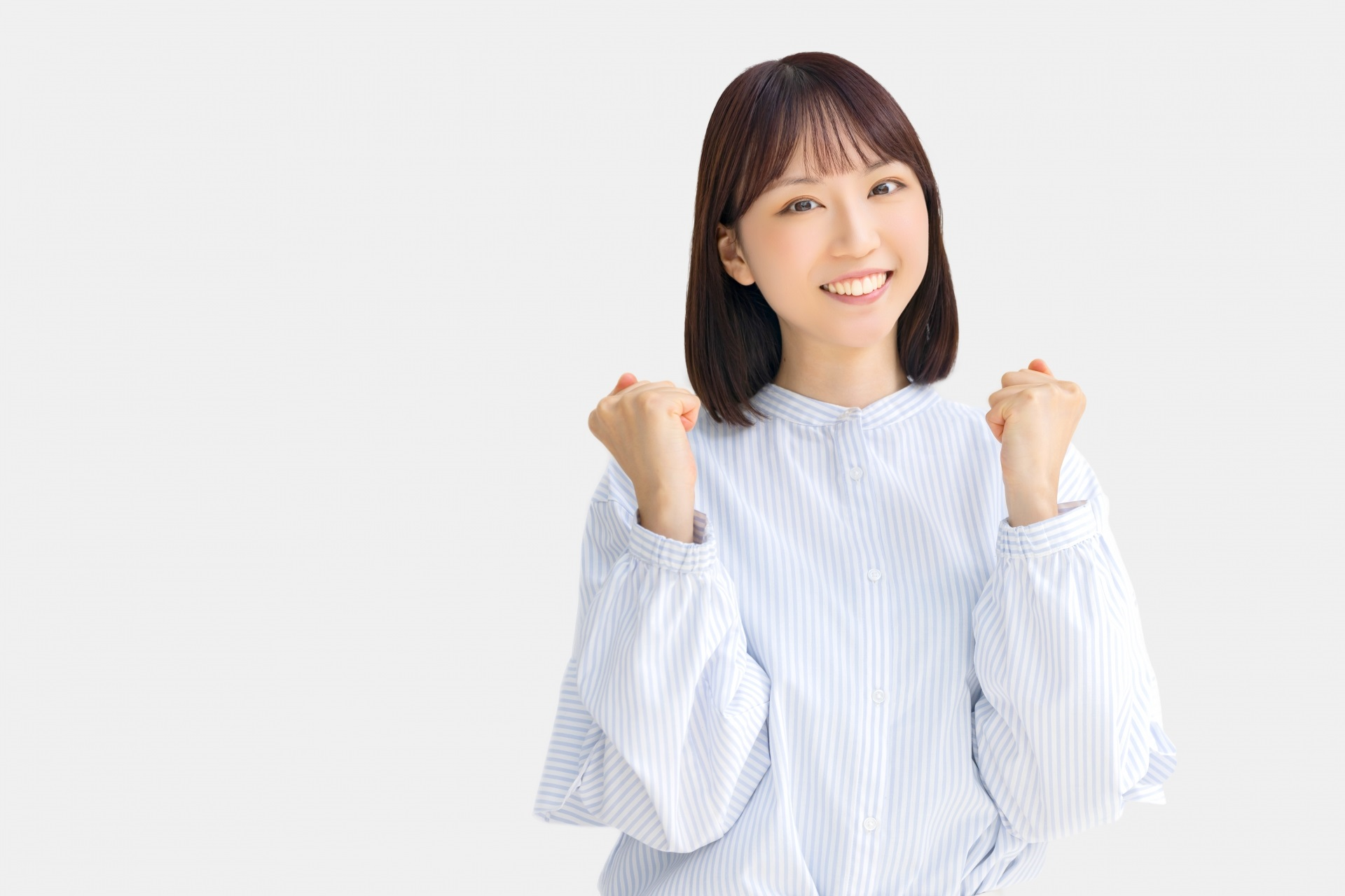 ガッツポーズをする女性・ビジネスウーマン